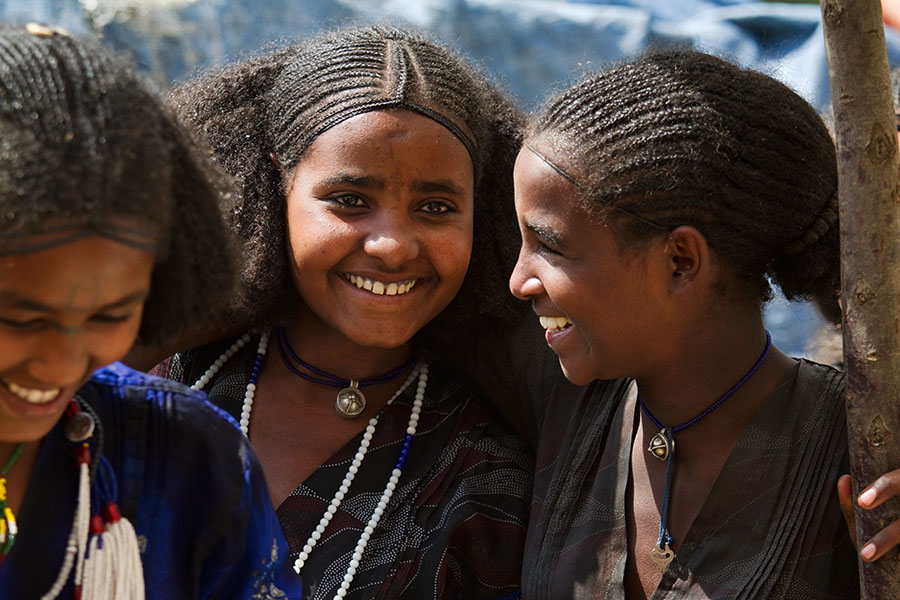 61   Girls from the Raya Wollo tribe shopping at Hayk market. Ethiopia 